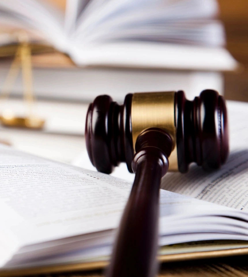 A judge 's gavel on top of some law books.