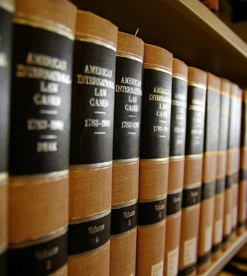 A row of law books on a shelf.